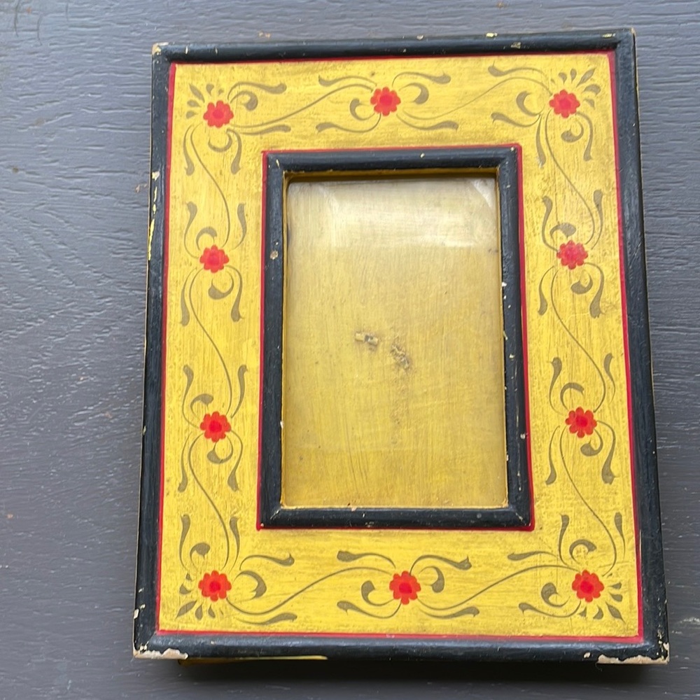 Decorative frame yellow with natural patina. Red flowers.  Height 10.25 inches